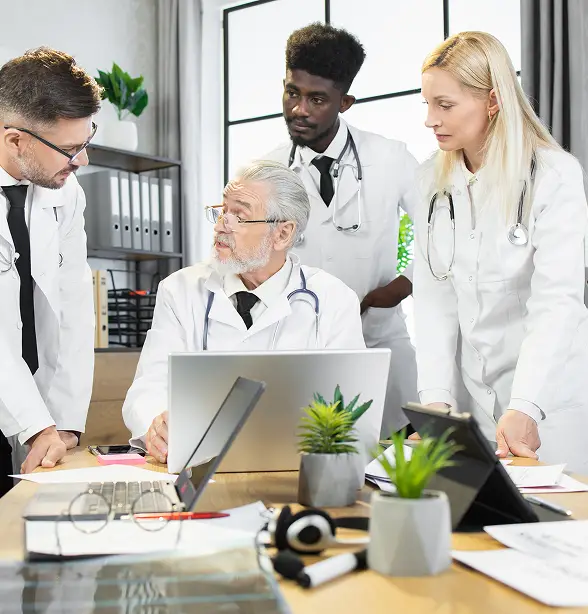 aged head-doctor-with-diverse-colleagues